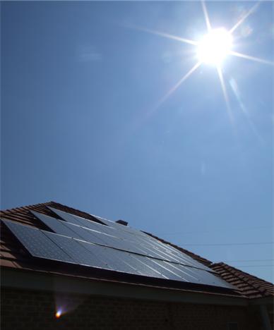 Sun shining on solar panels at firehouse